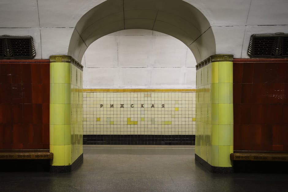 Elegant archway with ornate lighting in a Moscow metro station showcasing the system's palace-like architecture
